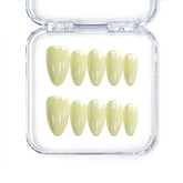 Naillover Singapore handmade short almond nails in glossy pastel yellow for a cheerful, soft look